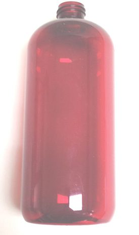 a red plastic bottle is sitting on a white surface .