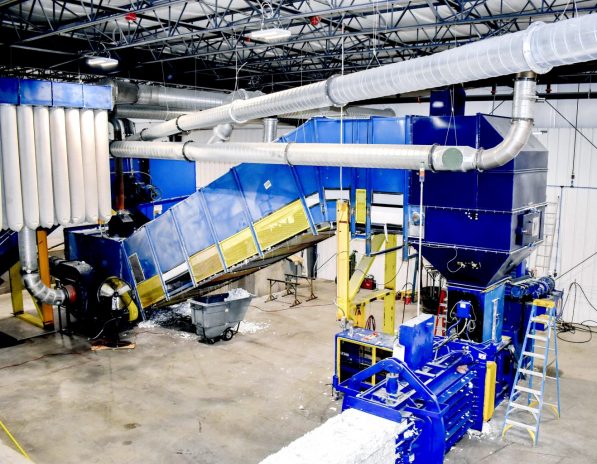 a paper baler machine in a factory